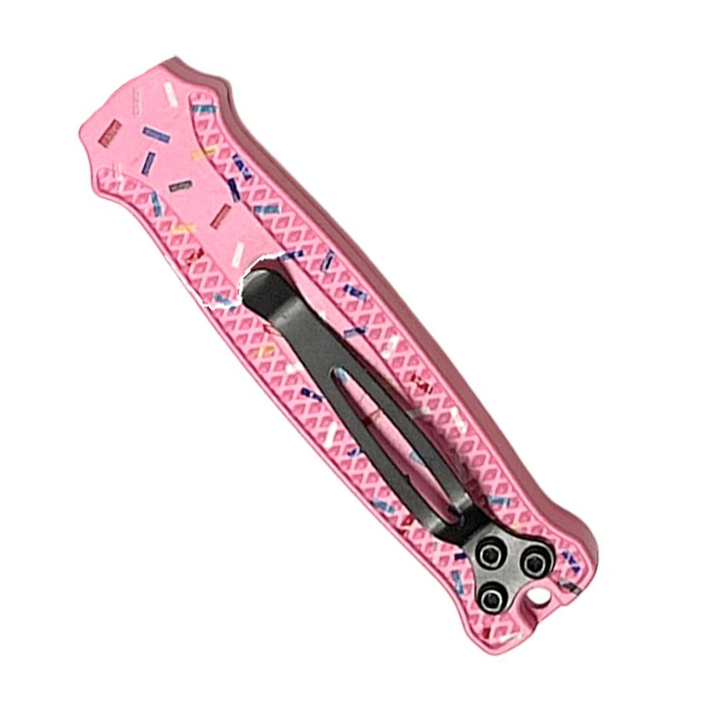 pink automatic out the front knife with decorative donut sprinkle handle closed