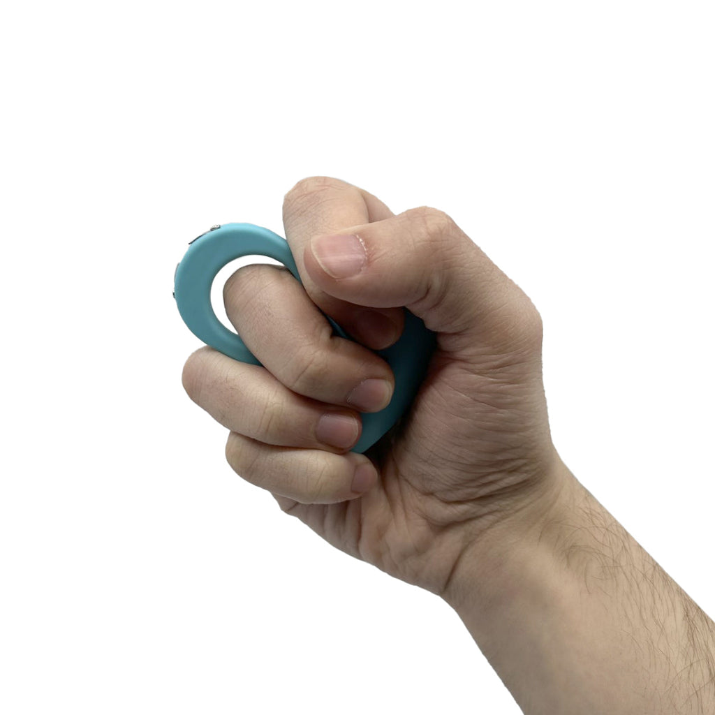 Streetwise finger ring stun gun electric knuckle teal compact personal safety product in hand